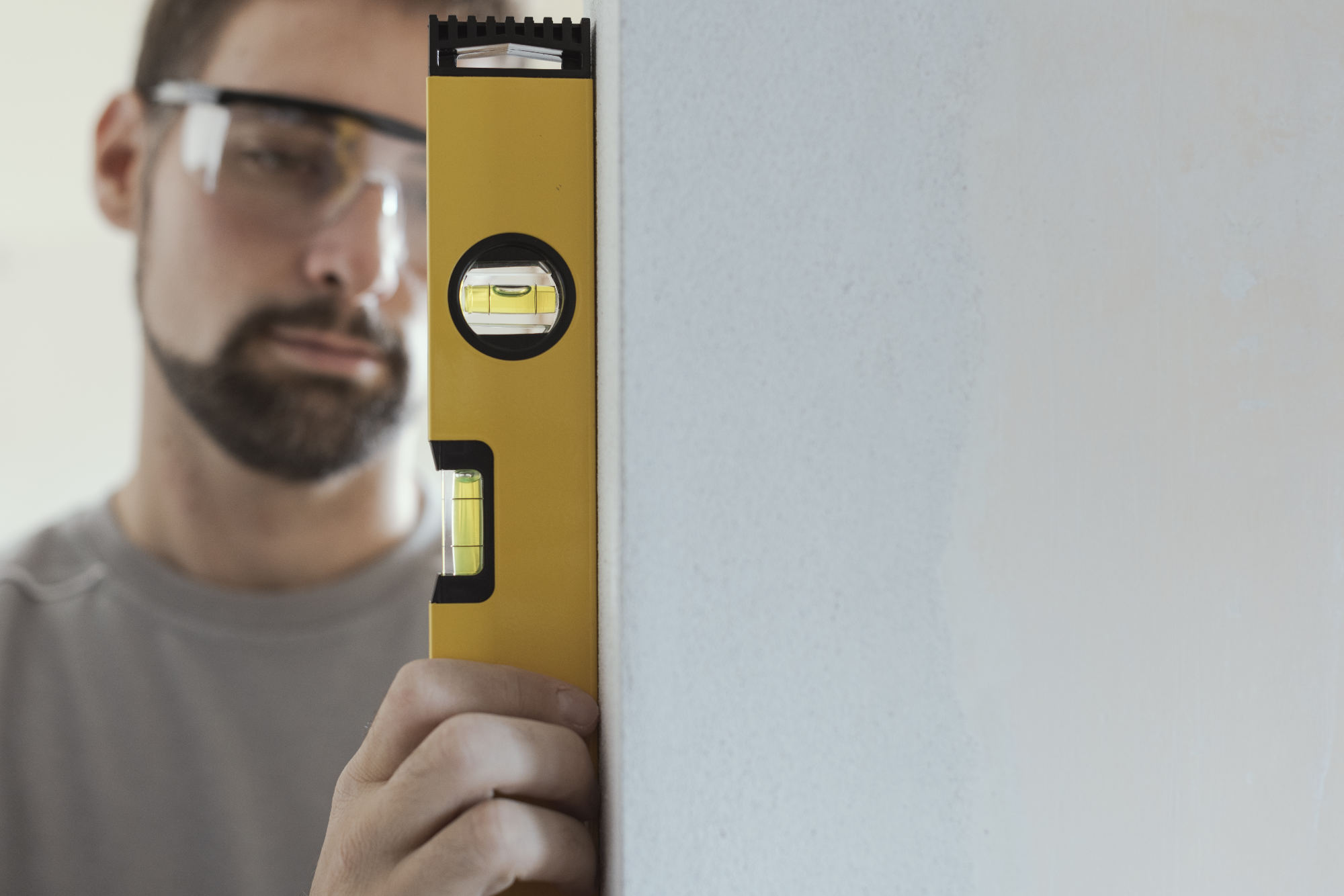 man-using-a-level-to-plumb-a-wall-VP9GT5F-1.jpg man-using-a-level-to-plumb-a-wall-VP9GT5F-1.jpg